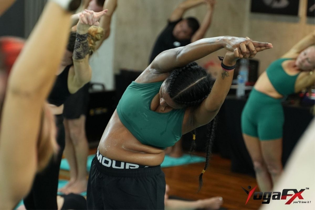 Group heated yoga class in session, reflecting research on heated yoga reducing depression and anxiety symptoms