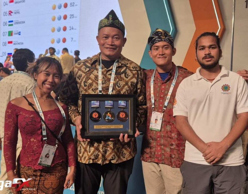 Indonesian Yogasana athletes on the podium receiving medals at the World Yogasana Championship 2026 in Ahmedabad