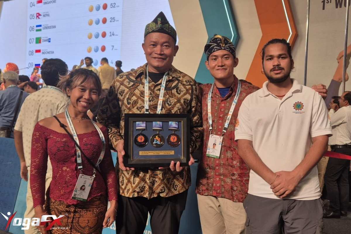 Indonesian Yogasana athletes on the podium receiving medals at the World Yogasana Championship 2026 in Ahmedabad