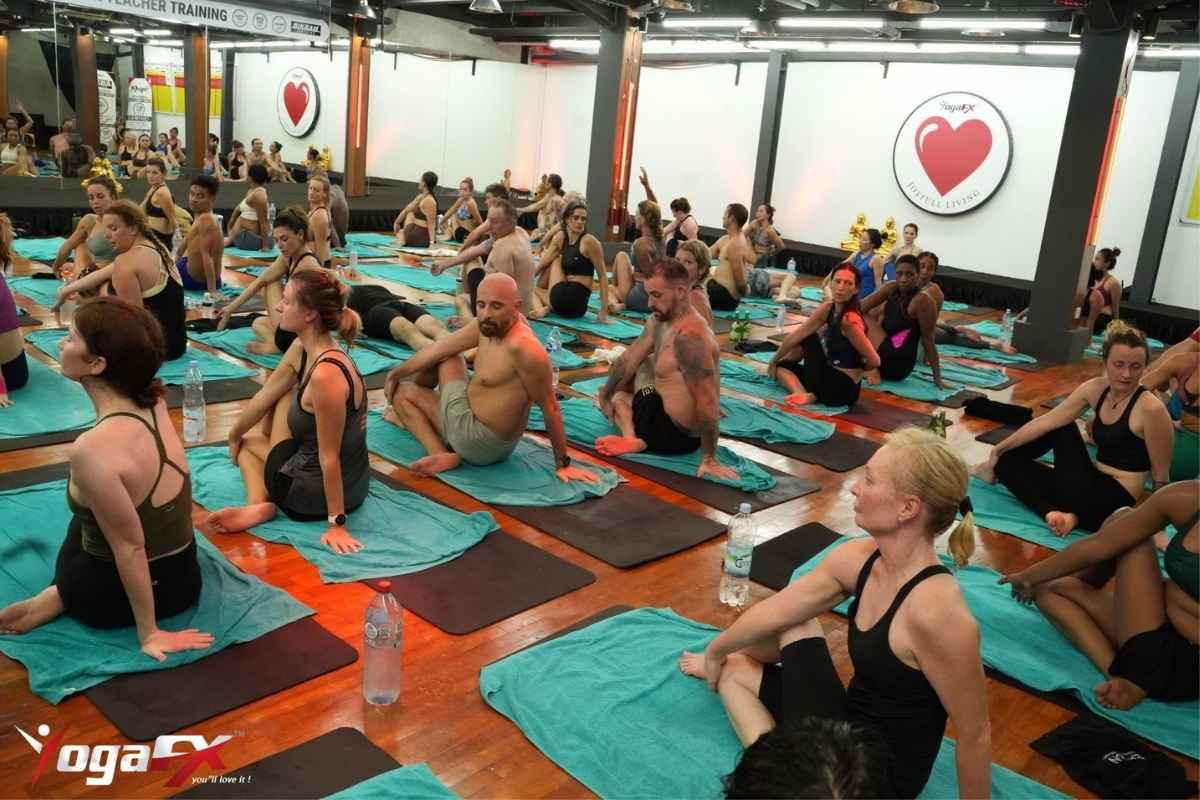 Newly certified yoga teacher leading a class after completing a 200-hour teacher training