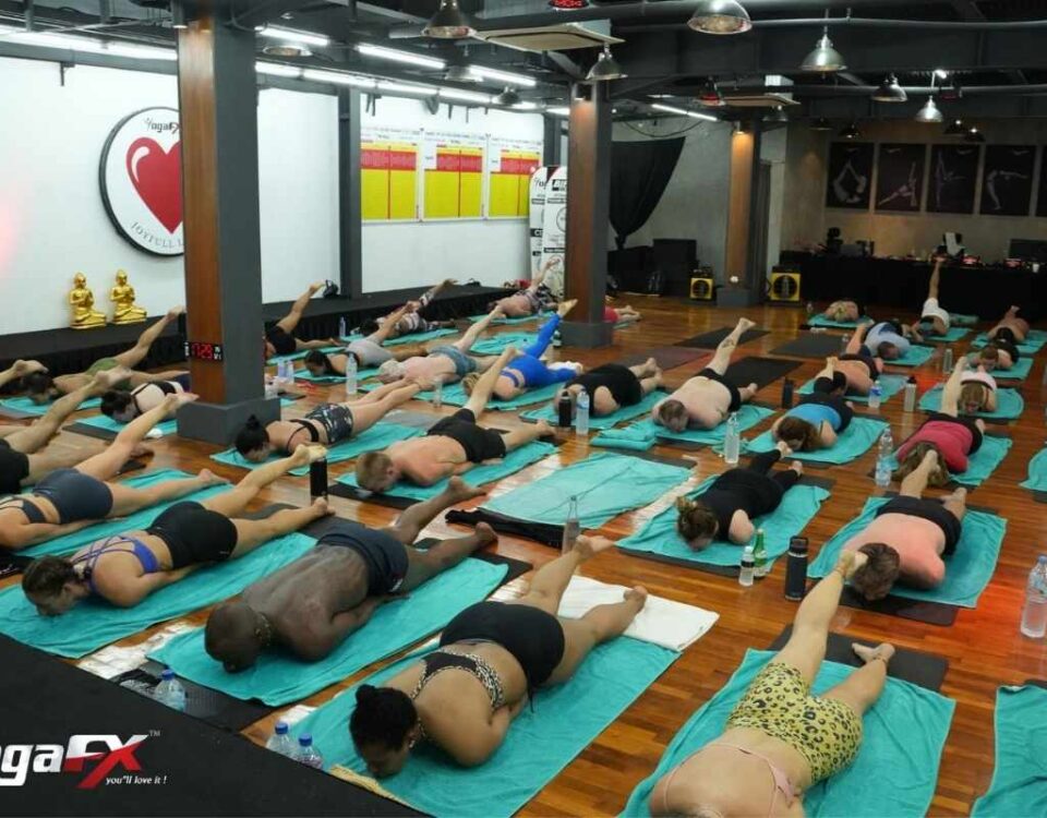 Comparison chart showing UK hot yoga teacher training costs versus Bali intensive programs