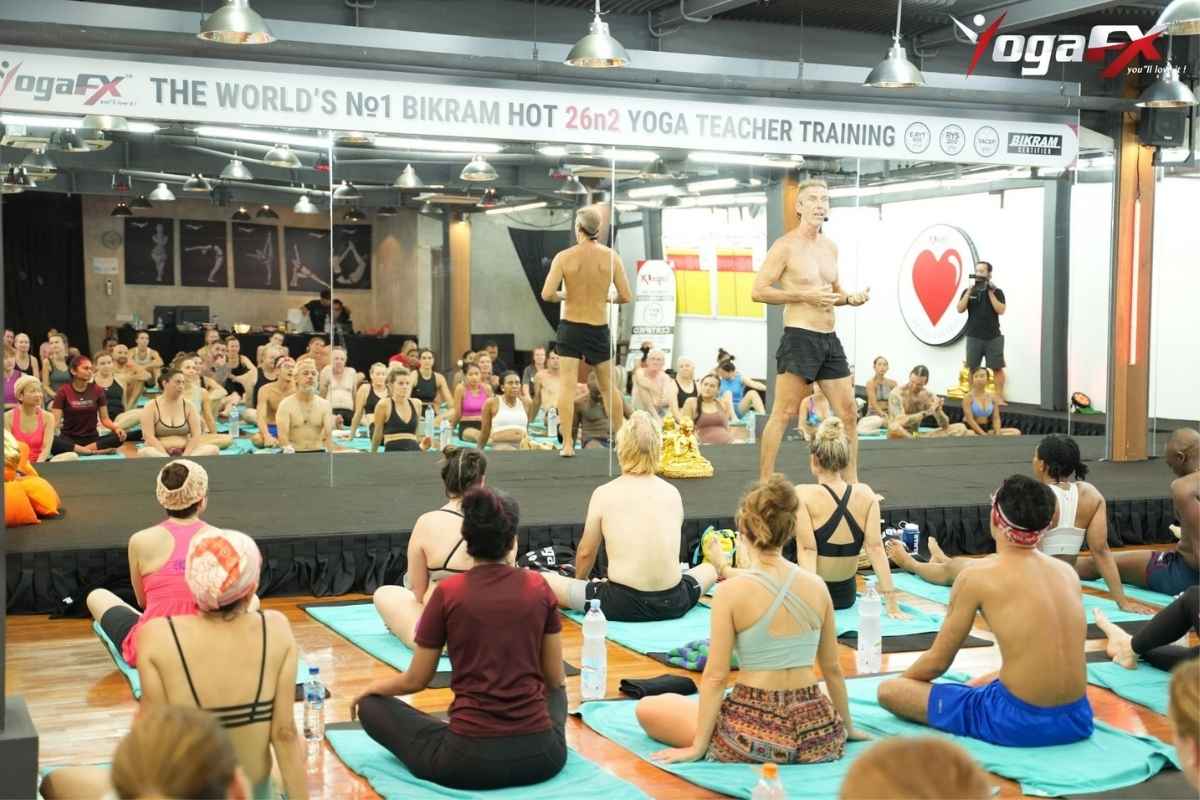 Practitioners stretching in a heated studio during a YogaFX hot yoga session