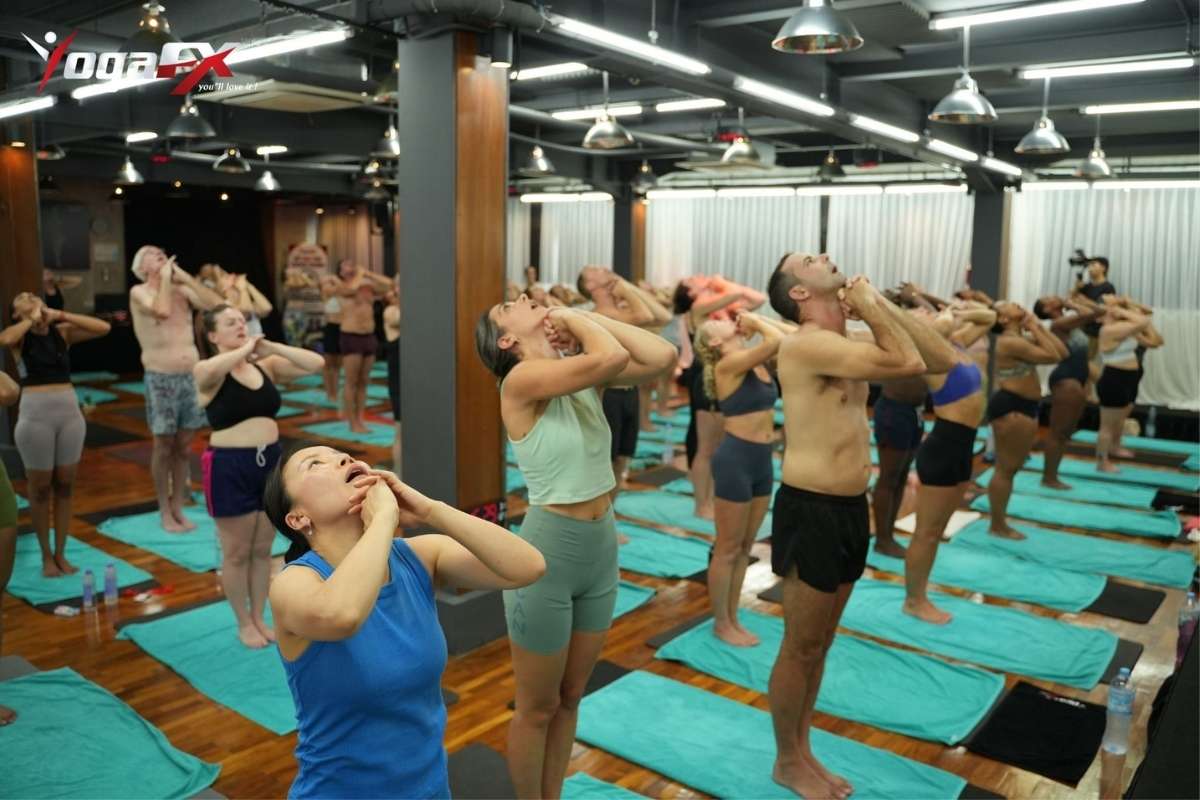 Woman practising yoga, representing the additional 300 hours of advanced training required to earn RYT 500